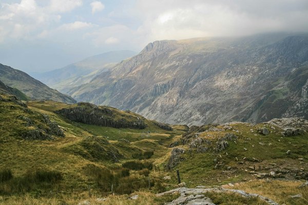 What are the most budget-friendly ways to experience the natural parks in Wales?